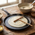 Râteau à crêpes rond en situation