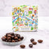 Boîte de chocolats Balade parisienne de Maison Vertigo et une coupelle d'amandes au chocolat