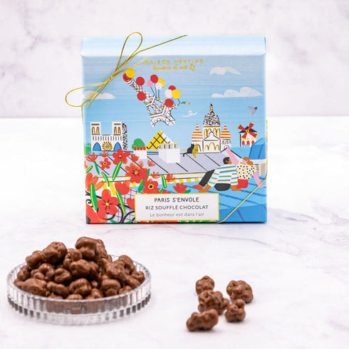 Boîte de chocolats Paris s'envole de Maison Vertigo et une coupelle de riz soufflé au chocolat