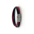 Bracelet deux cuirs croisés brun et rouge, fermoir aimanté en acier, photographié en boutique